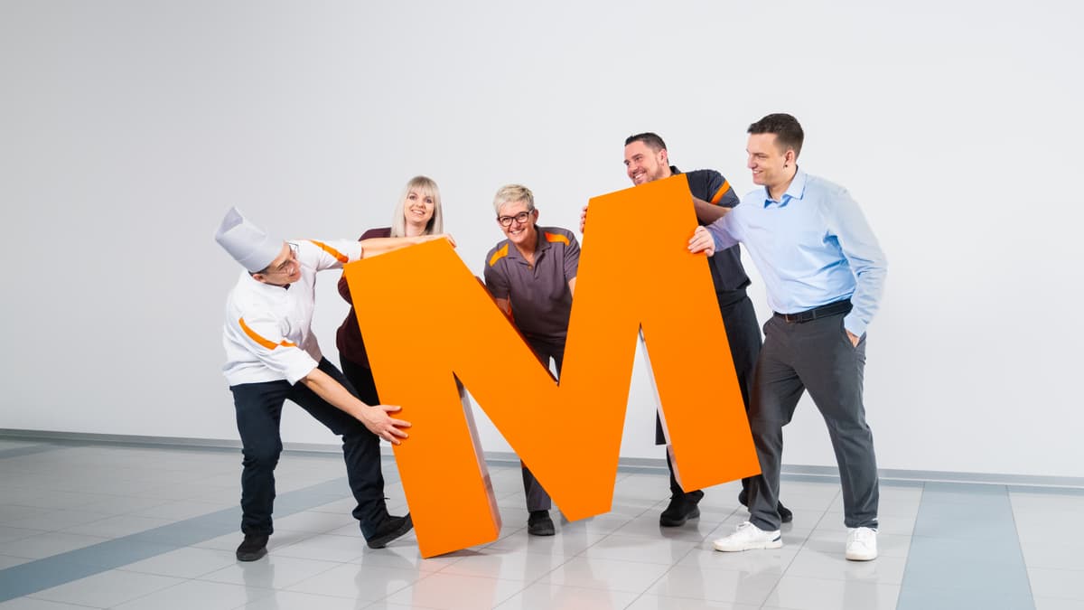 Team der Migros mit dem orangen grossen M