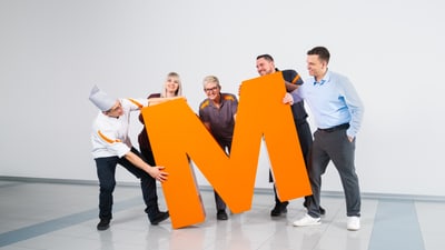 Team der Migros mit dem orangen grossen M